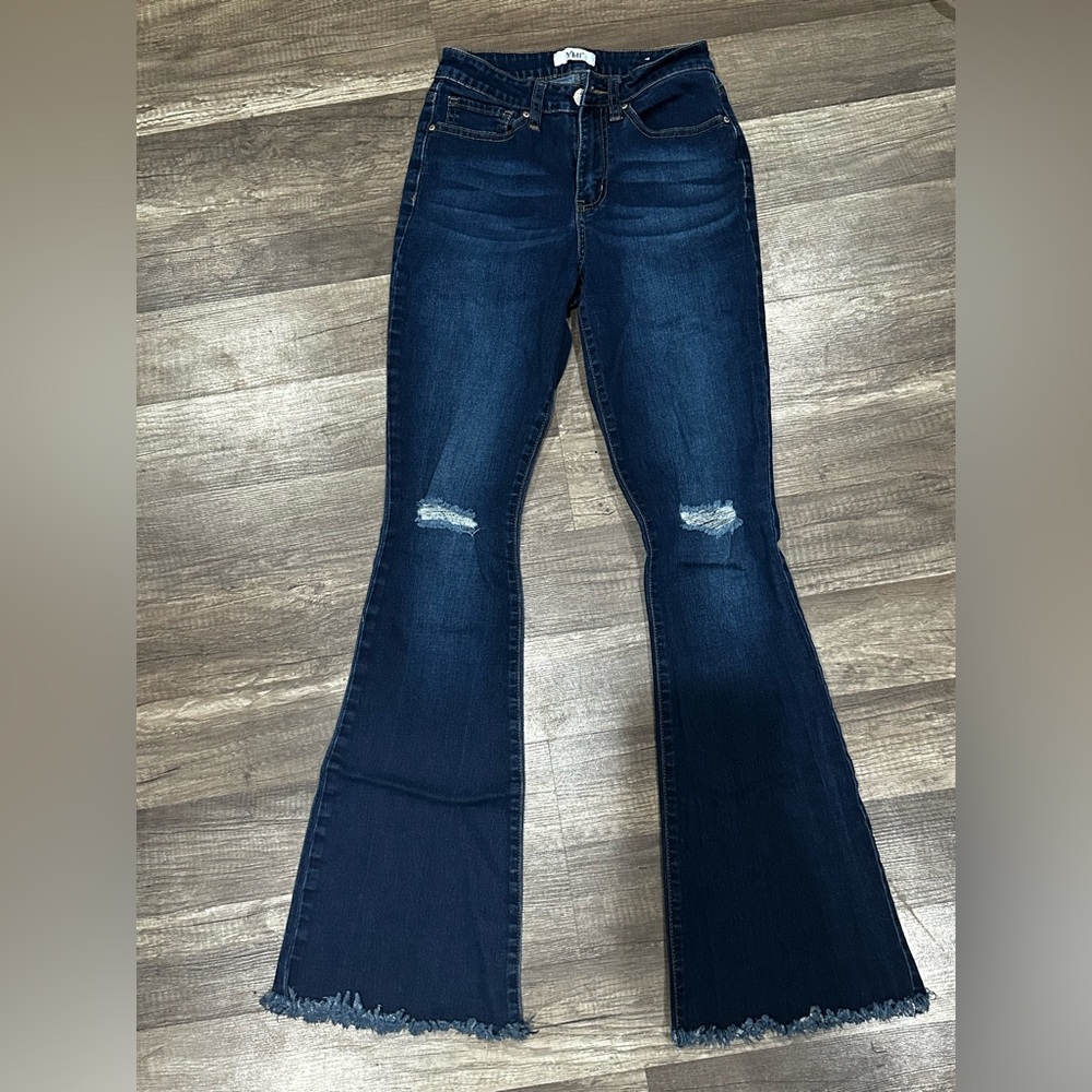 Distressed flare jeans.